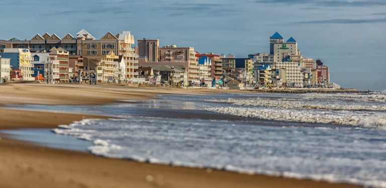 An ocean beach front skyline at sunset